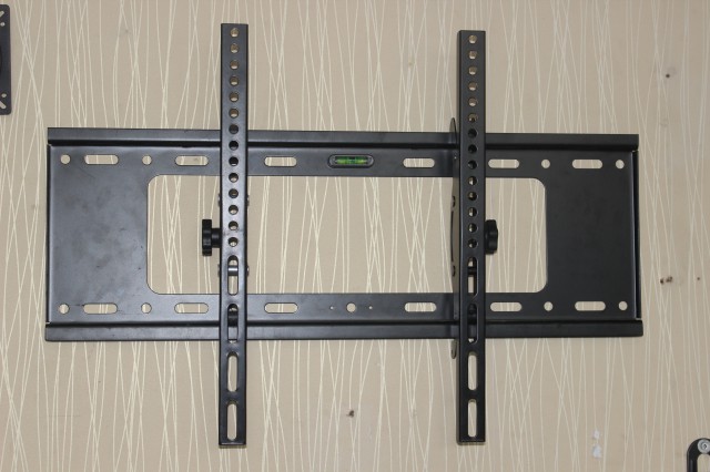 Adjustable tilt LCD TV rack